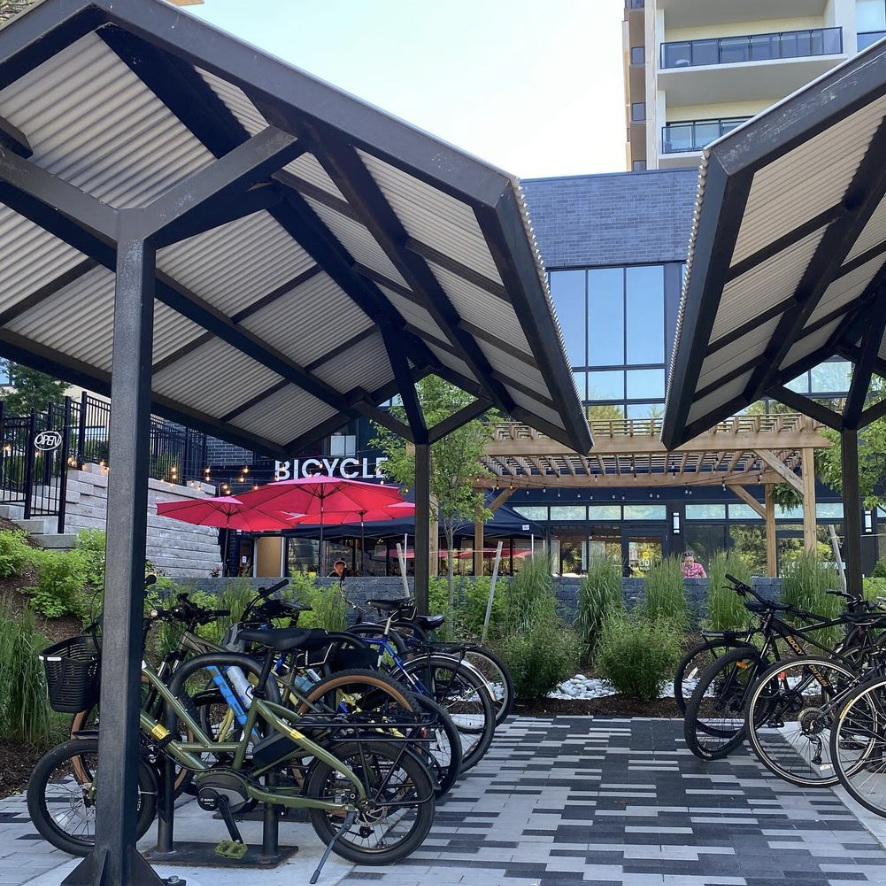 Bicycles parked at a bike rack conveniently close to all the shops
